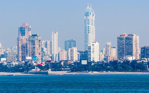 Mumbai skyline of high-rise towers seen across the sea from Marine Drive